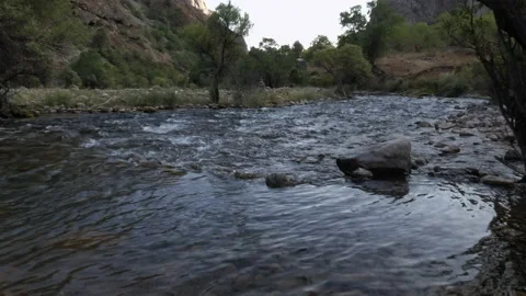 The mountain river has spilled into shallow water. Stock Footage 160947467