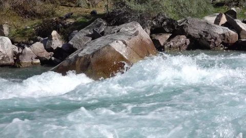 Mountain river hits a large stone 動画素材 116558957