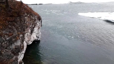 Mountain river in ice on the background of misty mountains Stock Footage 236835332
