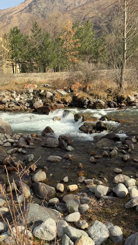 Mountain river landscape with rocks and flowing water outdoors, natural Stock Footage 336960182