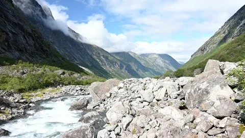 Mountain river leading through the forested valley near Trollstigen, Norway, 4K Stock Footage 159831383