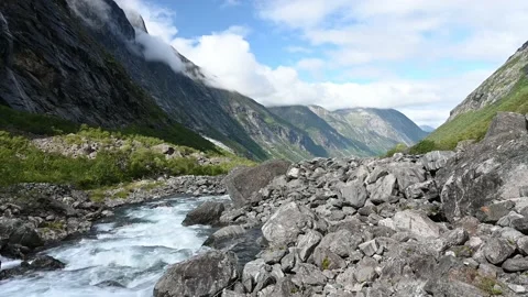 Mountain river leading through the forested valley near Trollstigen, Norway, 4K Stock Footage 159831384