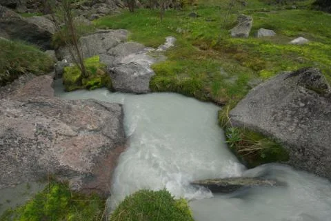 The mountain river in the mountains. Current through the gorge the river. S.. Stock Photos