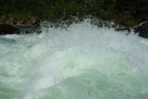 The mountain river in the mountains. Current through the gorge the river. S.. Stock Photos