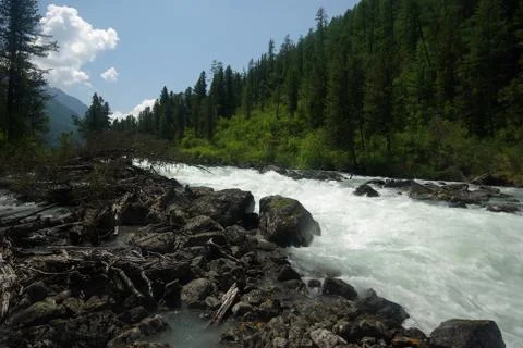 The mountain river in the mountains. Current through the gorge the river. S.. Stock Photos
