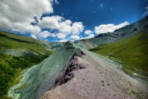 The mountain river in the mountains. Current through the gorge the river. S.. Stock Photos