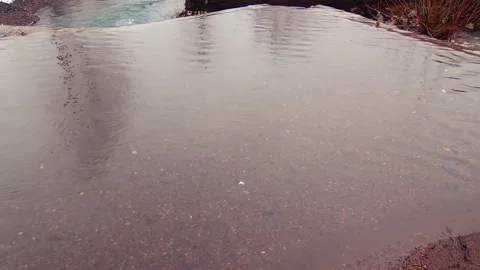 Mountain river passing trough snowy  landscape. Видео 237774697