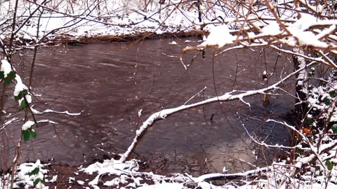 Mountain river passing trough snowy  landscape. Stock Footage 237774707