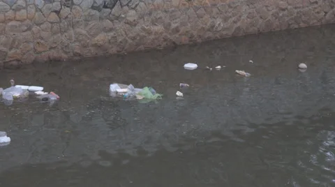 Mountain River Pollution, Garbage in Running Water, Polluted with Trash Stock Footage 68739187