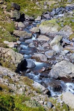 Mountain river with a rapid flow in the Caucasus Range. Stock Photos