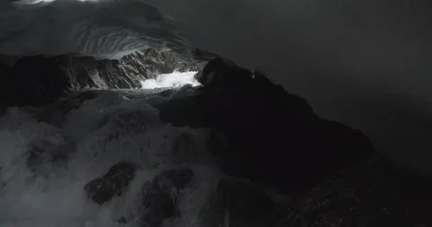 Mountain river rapidly flows through snow tunnel. Ural mountains. Stock Footage 269539820