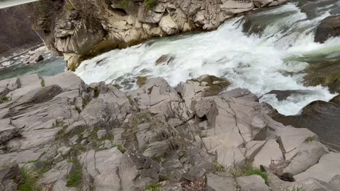 Mountain river rapids flowing between rocks in narrow canyon Stock Footage 313635261