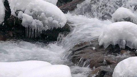 Mountain river rapids in winter slow motion Stock Footage 99656048
