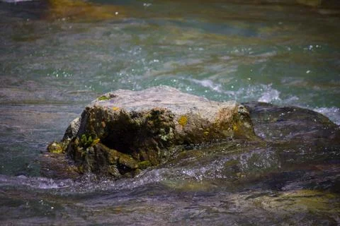 A mountain river with rock in it Stock Photos
