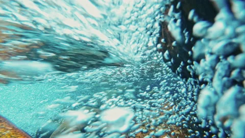 Mountain river with rocks, clear water and bubbles, underwater video shooting Stock Footage 136847112