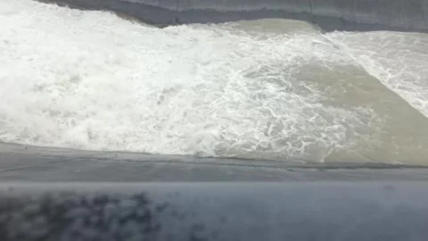 A mountain river rush along the concrete channel after the rain. 库存影片 338266886