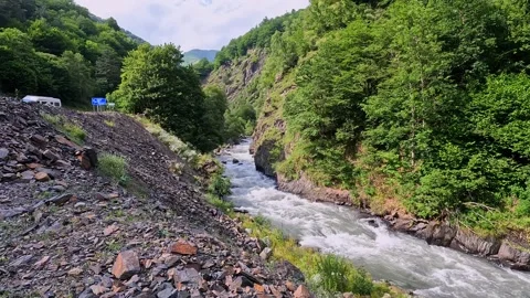 Mountain river rushing through dense forest near Roshka Stock-Footage 340385744