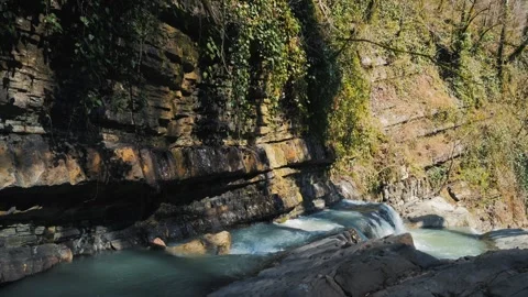 Mountain River Rushing Through Layered Rocks in Forest Stock Footage 270458775