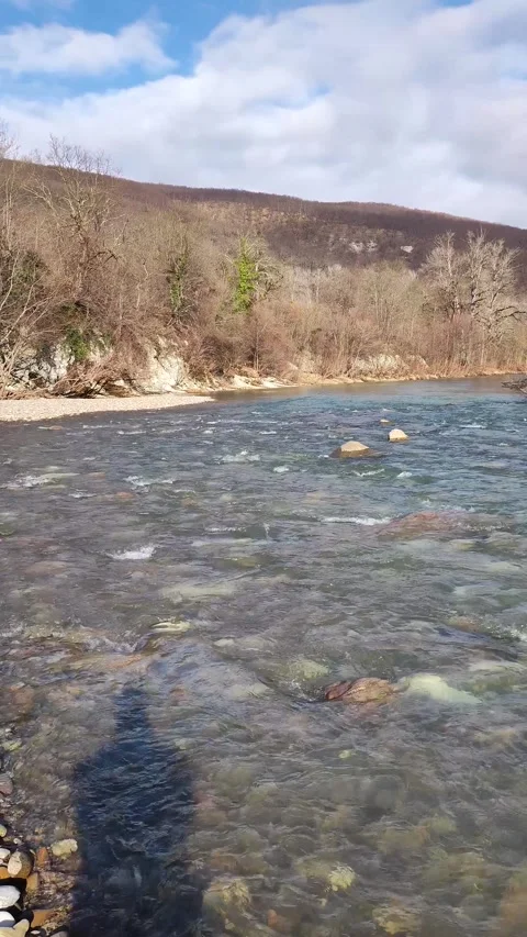 The Mountain River To The Shore. Vertical Video Stock Footage 297932800