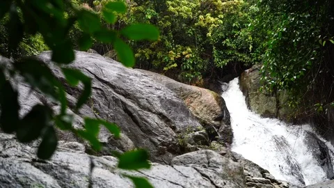 Mountain river, a small waterfall among the stones in the jungle Stock Footage 117297170