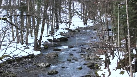 Mountain river with snow around Stock Footage 50492723