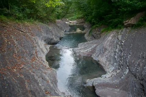 Mountain river in the stone bed Stock Photos