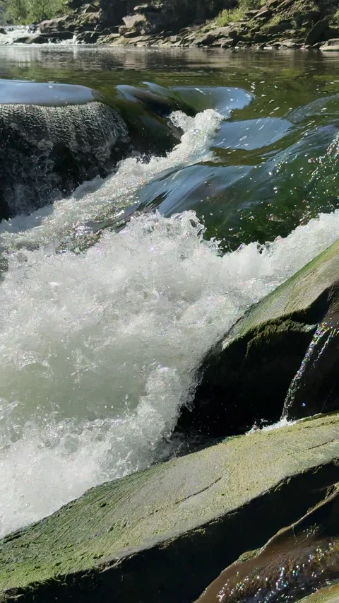Mountain river, stream flowing through rocks Video stock 316526908