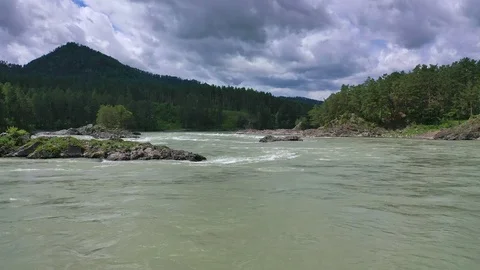 Mountain river in summer cloudy day Video stock 112928131