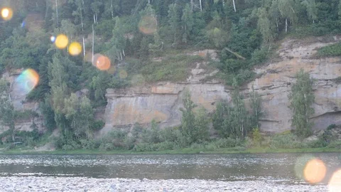 Mountain river on a summer day in the sunlight in the form of colored glowing ba Stock Footage 120182229