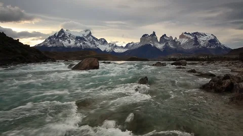 Mountain river at sunset with a view of the mountains. Torres del Paine, Chile Video stock 75665072