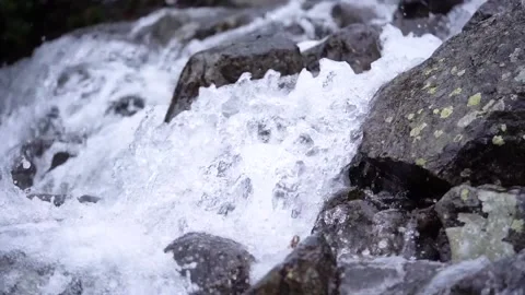 Mountain river swiftly descend over the stones, from a close distance Stock Footage 154415052