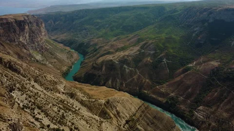 Mountain river with turquoise water flows along the bottom of the gorge Stock Footage 234325247