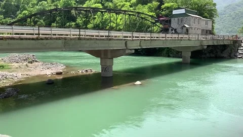 Mountain river under the bridge Stock Footage 150664513