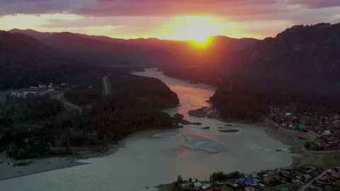 The mountain river view from high. Mountain landscapes. Pink sunset Stock Footage 143332615
