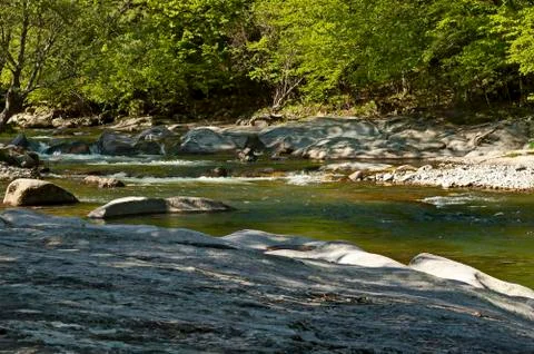 Mountain river Vit, which flows in a beautiful bed to big rocks and stones Stock Photos