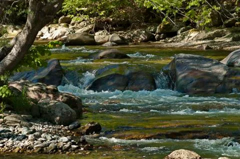 Mountain river Vit, which flows in a beautiful bed to big rocks and stones Stock Photos