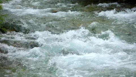 Mountain river. water flows in turbulent streams over stones. Stock Footage 245434085