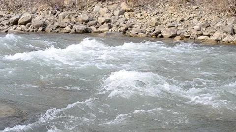 Mountain river with water quickly flowing along stony river bank Stock Footage 50086951