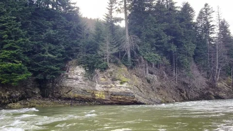 Mountain river. The water is seething on the river rapids. Raging mountain river Stock Footage 276507181