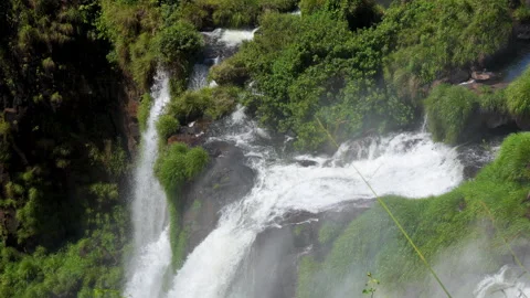 Mountain river waterfall creating heavy water mist 動画素材 335473830
