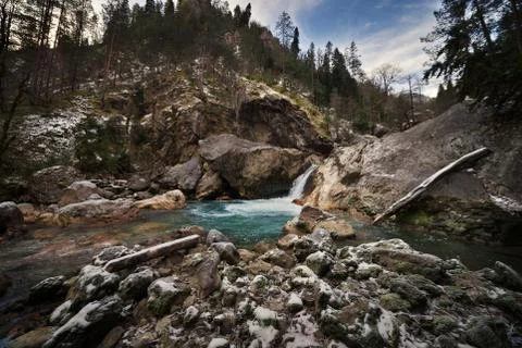 The mountain river with a waterfall. Stock Photos