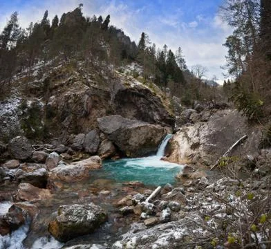 Mountain river with a waterfall Stock Photos