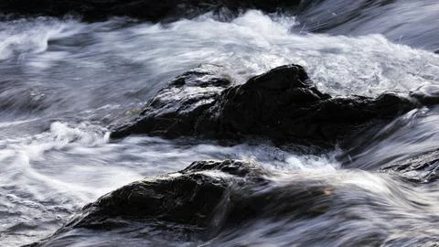 Mountain river wave texture, close-up, long exposure Stock Photos