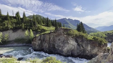 Mountain river in the wild. A powerful stream of water flowing through stone Stock Footage 247777195