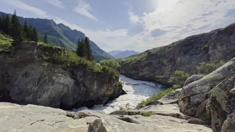 Mountain river in the wild. A powerful stream of water flowing through stone Stock-Footage 247777246