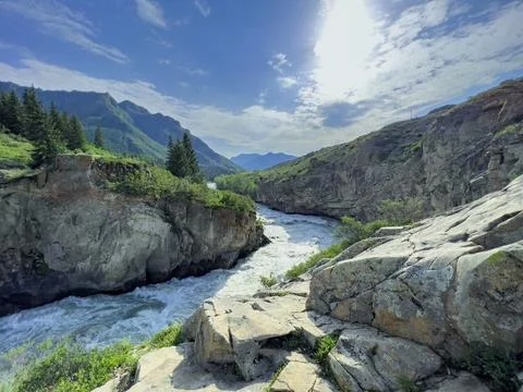Mountain river in the wild. A powerful stream of water flowing through stone Stock Photos