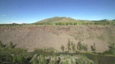 Mountain river winds through rocky valley - Mongol Landscape and Fast Current Stock Footage 339823165