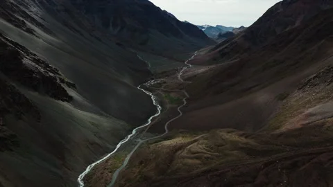 Mountain Road and Glacial Stream in Deep Valley of Ladakh Drone View Stock Footage 311554122