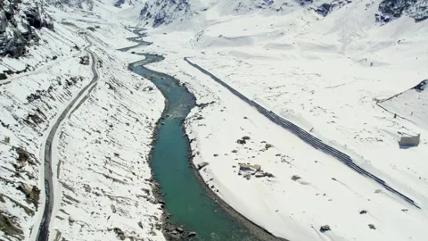 Mountain Road and River in Snow Valley Travel and Exploration Concept Video stock 332145009