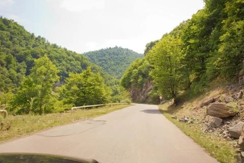 Mountain road between forests . Winding mountain road . A road in Azerbaijan  Stock Photos